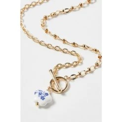 Oliver Bonas Audrey Natural Ceramic Flower Pendant T Bar Chain Necklace -Oliver Bonas Shop unnamed file 1584
